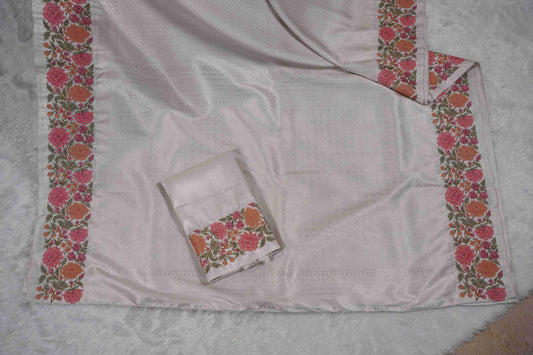 Silver Brocade Kanchi Saree with Orange & Pink Floral Petite Border